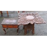 An Eastern carved occasional table, the square top carved with roses, 28ins x 27ins, height 24ins,