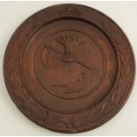 An Antique carved wooden dish, with a Masonic symbol to the top, carved with farming symbols to