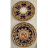 A Royal Worcester plate, decorated with a central panels of fruit by Leaman, to a blue and gilt