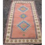 A 20th century rug, with hooked gulls to a pink ground, 84ins x 49ins