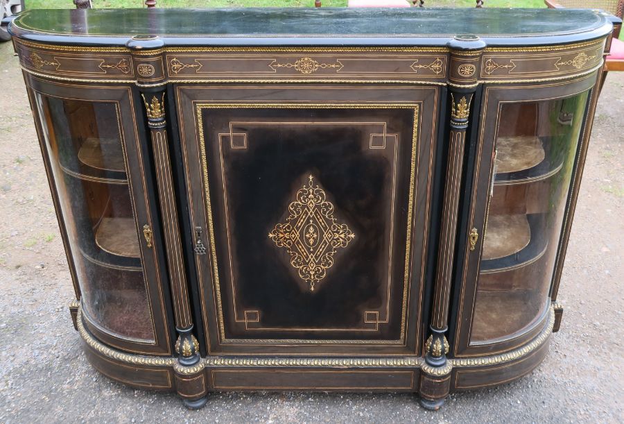 A Victorian ebony and inlaid credenza, fitted with a central cupboard flanked by two glazed bow