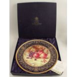 A Royal Worcester circular charger, decorated with fruit to a mossy background by Sally Wood, No. 1,