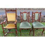 A rocking chair, with carved decoration, upholstered panel to the back and seat, together with a