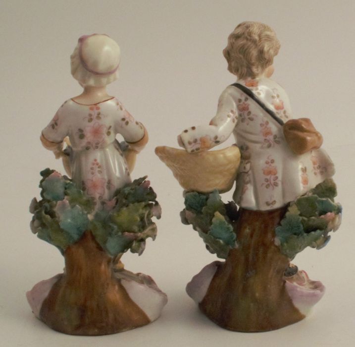 A pair of figures, harvest gatherers against a tree stump, with AR marks to the base, height 4.5ins - Image 2 of 5