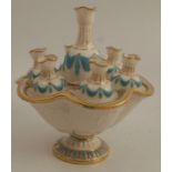 A 19th century unmarked Worcester porcelain bud vase, formed as a central urn surrounded by six