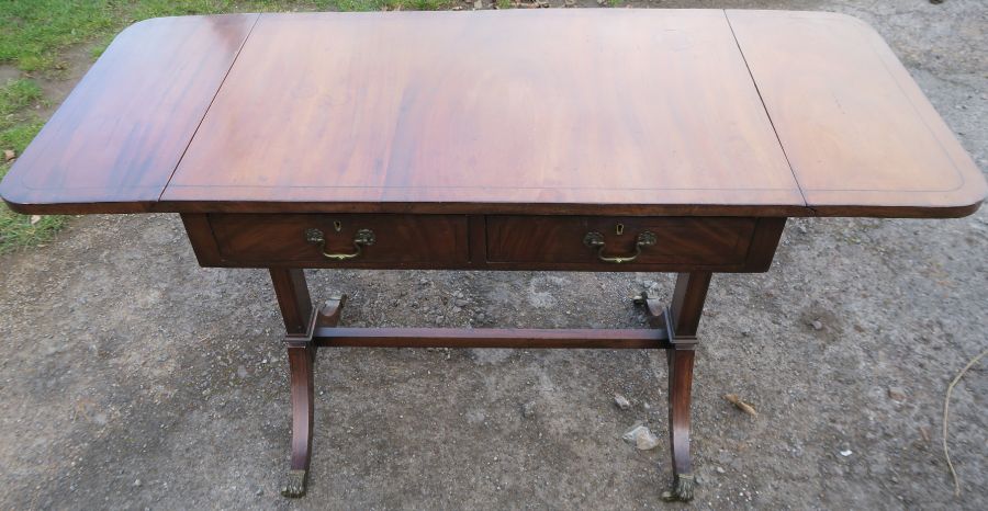 A reproduction mahogany sofa table, width 51.5ins x 21ins, height 30ins