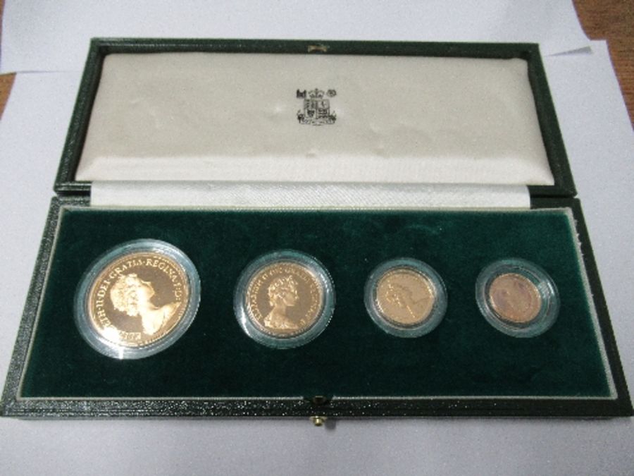 A cased Queen Elizabeth II 1980 gold proof set, comprising £5, £2, sovereign and half sovereign