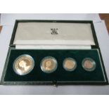 A cased Queen Elizabeth II 1980 gold proof set, comprising £5, £2, sovereign and half sovereign