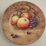 A Royal Worcester cabinet plate, decorated with fruit to a mossy background, unsigned, diameter 10.