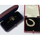 A late Victorian seed pearl set horseshoe brooch, cased, together with a seed pearl set bow