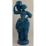 A 19th century English majolica model, of a woman carrying a pitcher, height 20ins