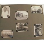 A photograph album, containing black and white snap shots from the Middle East