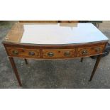 A 19th century mahogany bow front side table, fitted with three frieze drawers, width 54ins,
