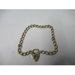 A 9 carat gold bracelet, of curb links to a padlock clasp, 7.5g gross