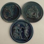 Three English majolica circular plaques, embossed with figures, diameter 5.75ins