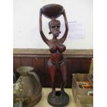 A tribal model of a lady holding a bowl on her head, height 33ins