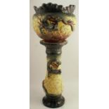 A 19th century majolica jardiniere bowl and stand, embossed with a green and brown dragon to a