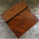 A 19th century mahogany lap desk, with folding sloping writing surface and covered compartments,