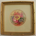 A Royal Worcester circular plaque or plate centre, decorated with flowers by Ernest Barker, dated