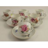 A set of six Meissen porcelain cups and saucers, decorated with flowers, crossed swords mark to