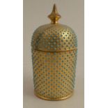 A Coalport porcelain cylindrical covered pot, with turquoise jewelling to a gold ground, height 3.