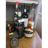 A collection of alcohol, to include Grand Marnier, port, whisky, ouzo, etc.