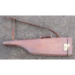 A vintage leg of mutton leather gun case, with replacement strap