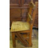An oak Gothic style metamorphic library chair steps