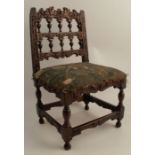 A 17th century style child's chair, with carved spindle back