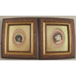 A pair of porcelain oval plaques or plate centres, portraits of dogs, unsigned, maximum diameter 2.