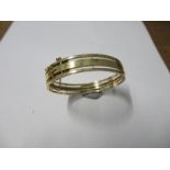 A hinged bangle, stamped '9ct', by Deakin and Francis, 14.9g gross