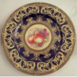 A Royal Worcester plate, decorated with a hand painted fruit centre by S Weston, to a rich blue