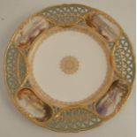 A Copeland porcelain cabinet plate, the pierced border decorated with four landscapes in reserves of