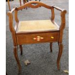An Edwardian piano stool, with upholstered rising seat, open arms and inlaid decoration, width 19.