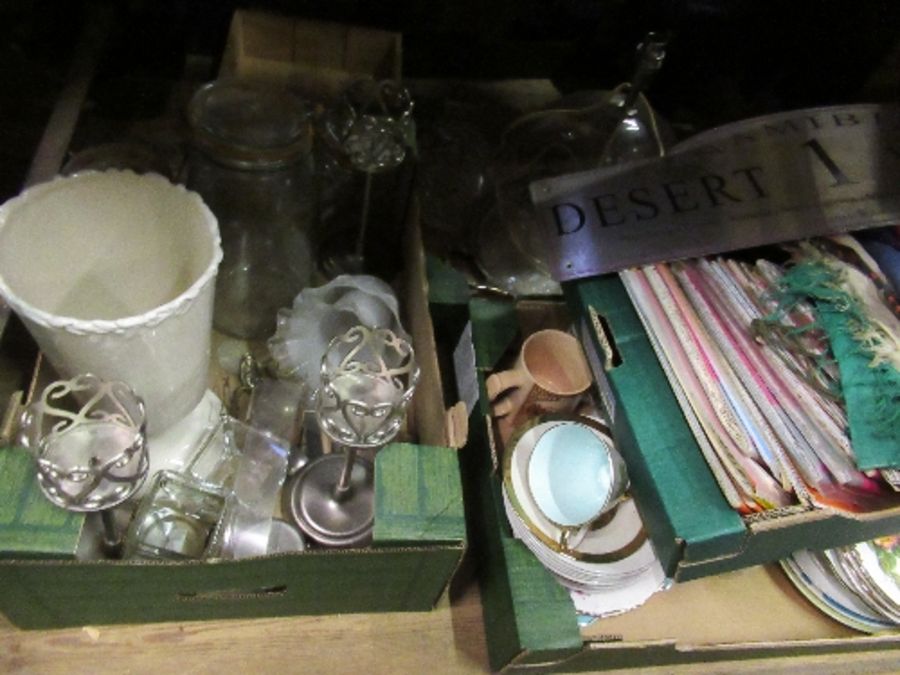 Four boxes of sundries, including glass, maps, flags, teaware, etc.