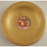 A Royal Worcester tazza, decorated with a central panel of fruit by Reed, to an etched acid gilt
