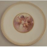 A 19th century Mintons porcelain cabinet plate, decorated with a putti playing a lyre and music,
