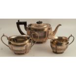 A silver three piece tea set, with ribbed band to the shaped body, Chester 1898, weight 20oz all in