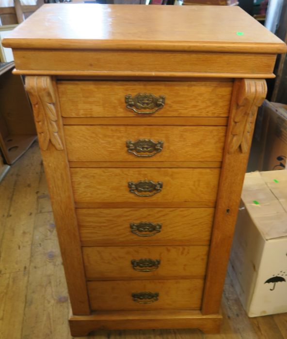 An oak Wellington chest, fitted with six drawers, width 22ins x depth 16ins x height 40.5ins