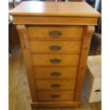 An oak Wellington chest, fitted with six drawers, width 22ins x depth 16ins x height 40.5ins