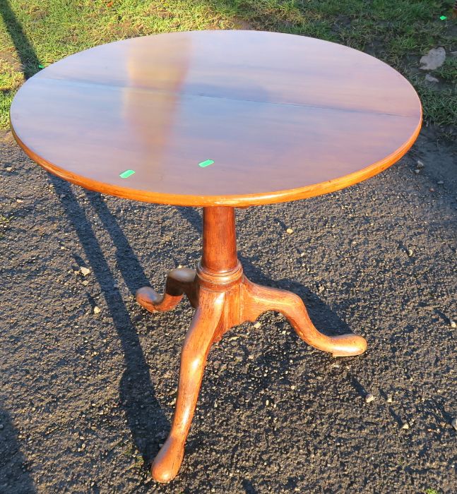 An Antique mahogany circular table, with bird cage action, on a tripod base, diameter 28ins,