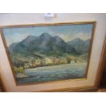 A 20th century oil on canvas, view across water to town and mountains, signed and dated, 13.5ins x