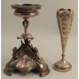 A silver plated stand base, decorated with winged lions, height 8ins, together with an Indian silver