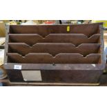 A wooden stationary rack, 13ins x 21ins