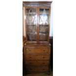A 19th century mahogany secretaire bookcase, the upper section having a pair of glazed doors, the
