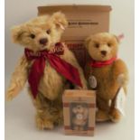 A modern Steiff teddy bear, in gold plush, wearing a red bow embroidered 1880 - 2005, height