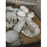 A box of assorted tea ware