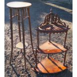 A set of walnut tiered corner shelves, with pierced top and turned columns, height 34ins, together