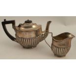 A silver bachelors tea pot, together with matching ilk jug, with gadrooned lower body, Birmingham