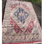 An Eastern style rug, the field made up of diamonds, 86ins x 53ins